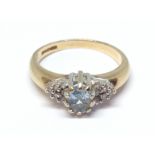 A 9ct gold aquamarine and diamond cluster ring, 9ct gold international convention marks, gross wt.
