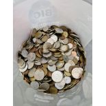 A tub of assorted world coins.