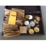 A box of assorted watch spares and a box of pocket watch movements.