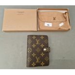 A Louis Vuitton address book, with cloth cover and original box.