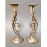 A pair of weighted hallmarked silver vases, Joseph Rodgers & Sons, Sheffield, 1901, 19cm high.