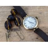 A ladies 9ct gold Thomas Russell wristwatch with leather strap and a pair of amber imitation drop