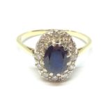 A diamond and sapphire cluster ring, the oval cluster measuring approx. 13mm x 11mm, marked '