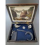 A lidded wooden box containing vintage collectables to include a bracelet marked 925, snuff box