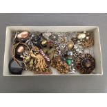 A box of assorted vintage and modern costume jewellery.