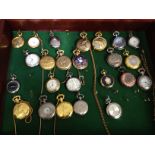 Various pocket watches in a glass fronted display cabinet.