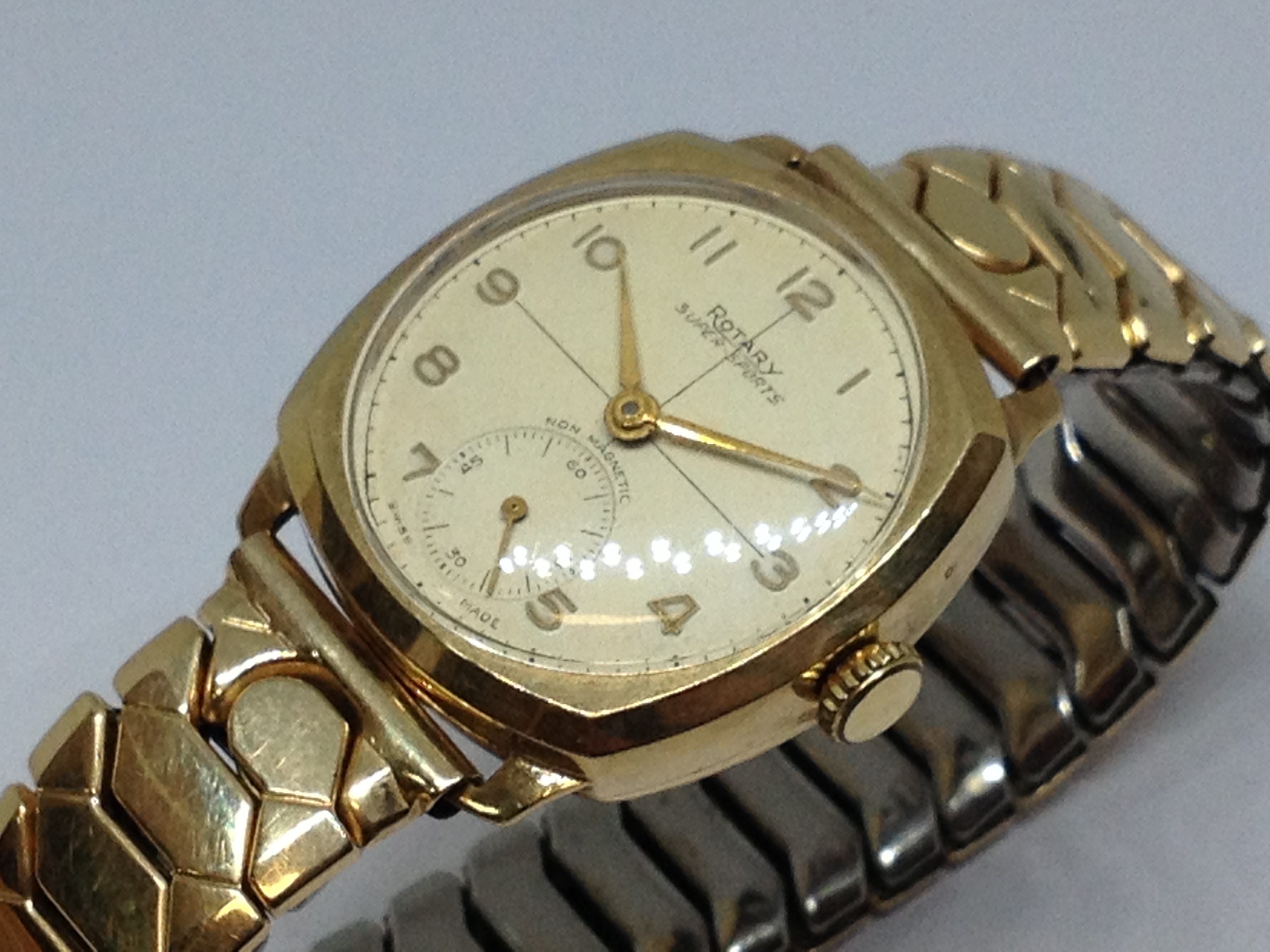 A 9ct gol Rotary Super-Sports wristwatch with gold plated flexi strap.