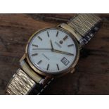 A vintage 9ct gold Roamer automatic wristwatch with gold plated flexi strap.