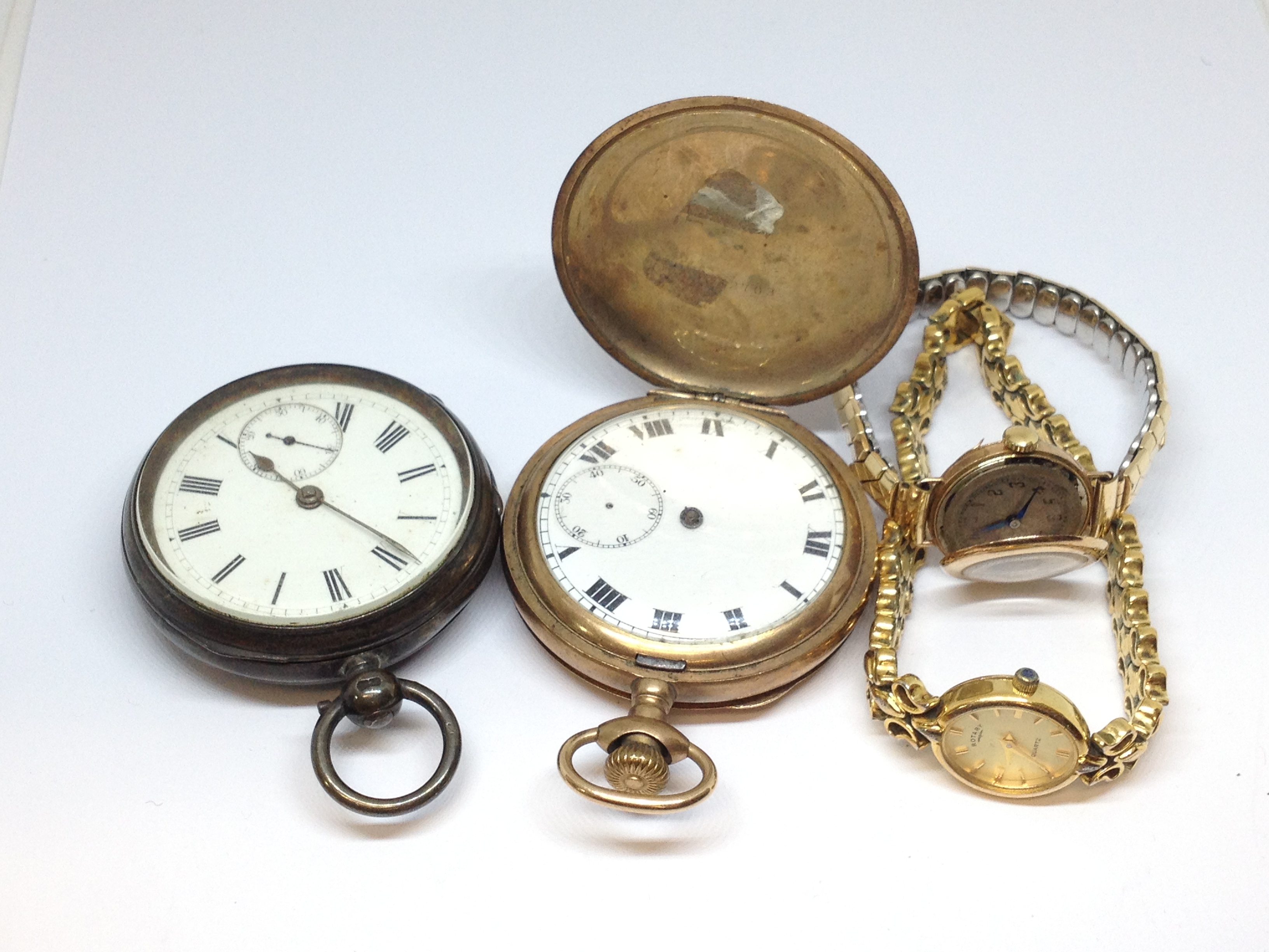 A mixed lot of watches comprising a hallmarked silver open faced pocket watch, a gold plated Vertex,