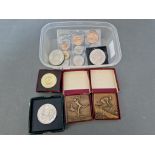 Assorted medals and coins including two Bronze sporting medallions, a Festival of Britain crown,