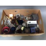 A box of assorted gramophone accessories.