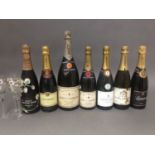 Seven bottles of vintage champagne including Moet & Chandon, Taittinger, Perrier-Jouet with matching