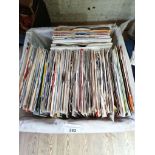 A basket of approximately 150 vinyl 7" singles, 1960s to 1990s, including The Beatles, Elvis, The