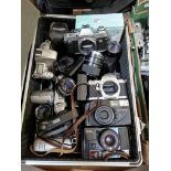 A case of cameras and camera equipment including Canon, Pentax, Zeiss, lenses, binoculars, etc.