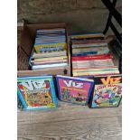 Two boxes of annuals to include Viz, TinTin, Asterix, The Gladiator, etc.