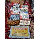 A box of model kits, mainly Airfix.