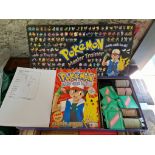 A 1999 Pokemon sticker album, complete and a vintage Pokemon Master Trainer board game 99% complete.