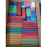 A box of books including Harry Potter and A Series of Unfortunate Events.