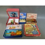 A box of vintage toys and games to include a cca 1930s Tri-Ang Gyro Cycle, Hornby Dublo, Dinky, etc.