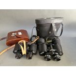 A pair of Carl Zeiss Jena Jenoptem binoculars and another pair.