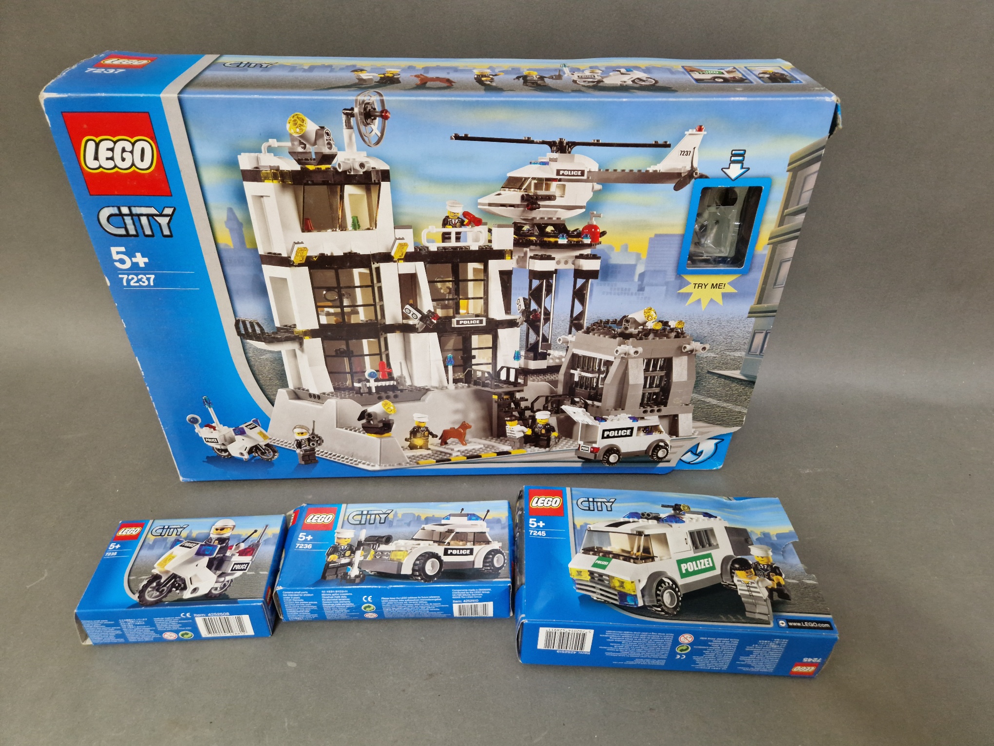 Four boxed Lego Sets; Motorcycle Set, 7236- Police Car Set, 7237- Large Full