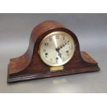 A Westminster chime domed oak mantle clock with presentation plaque in Welsh, length 43cm.