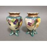 A pair of Hadley Worcester vases, height 9.5cm. Condition - one with chip and repair to rim.