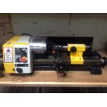 A Cobra lathe, 7" diameter, swing 140mm, 100-2000 RPM, spindle MT2, with accessories.