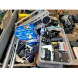 Two boxes of photographic equipment including SLR cameras, lenses, unused film, a Nikon 35mm camera,