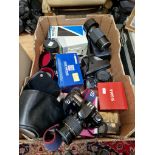Two SLR cameras; Canon & Olympus with assorted lenses and accessories.