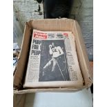 A box of Melody Maker and Musical Express magazines / newspapers.