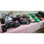 Five assorted RC model vehicles.