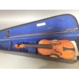 A 20th century student violin, labeled 'Medio Fino' with bow & hard case.