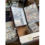 A box of GB stamp albums, stamps and postcards.