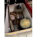 A box of miscellaneous including a shooting stick / seat, a globe, a lantern, brass taps, barometer,