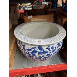 A box with quantity of Fleurette tableware and a large blue and white planter.