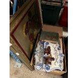 A mixed lot comprising a still life oil, a majolica rack (af) and assorted children's literature