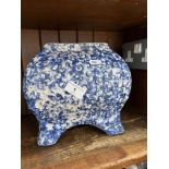 A glazed blue and white planter