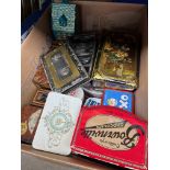 A box of vintage tins to include money tins etc.