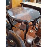 An Edwardian mahogany two tier table.