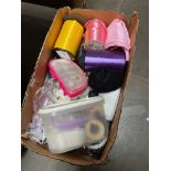 A box of assorted craft materials