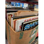 A box of sports annuals and magazines - mainly football and athletics