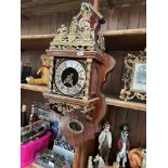 A large Dutch wall clock with weights, bearing name Nue Elck Syn Sin