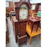 A Georgian oak cased grandfather clock with enameled dial, weights and pendulum.
