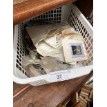 A basket of stamps, postcards, photographs etc