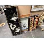 A Chinese black lacquer and mother of pearl panel, two Eastern carved wood and gilded wall plaques