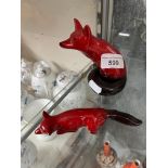 Two Royal Doulton Flambe foxes