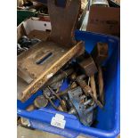 A box of tools to include a woodworking vice, a small stool, plane, etc.