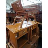 A pair of hardwood bedside cabinets and an x-frame stool.