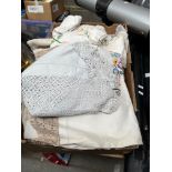 A box of linen, crochet ware, etc